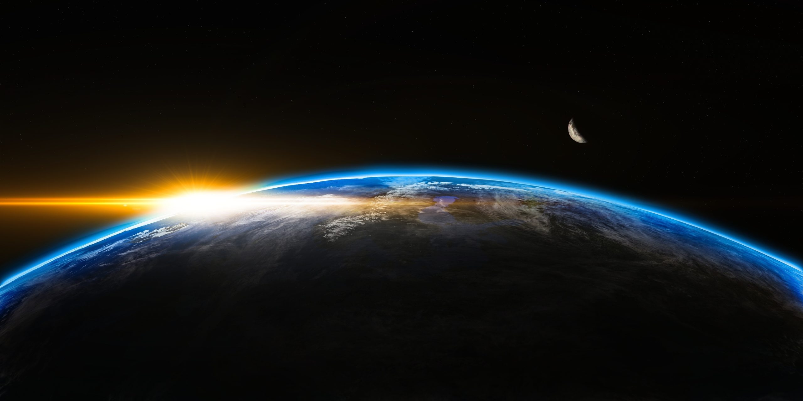 Sun rising over Earth from orbit